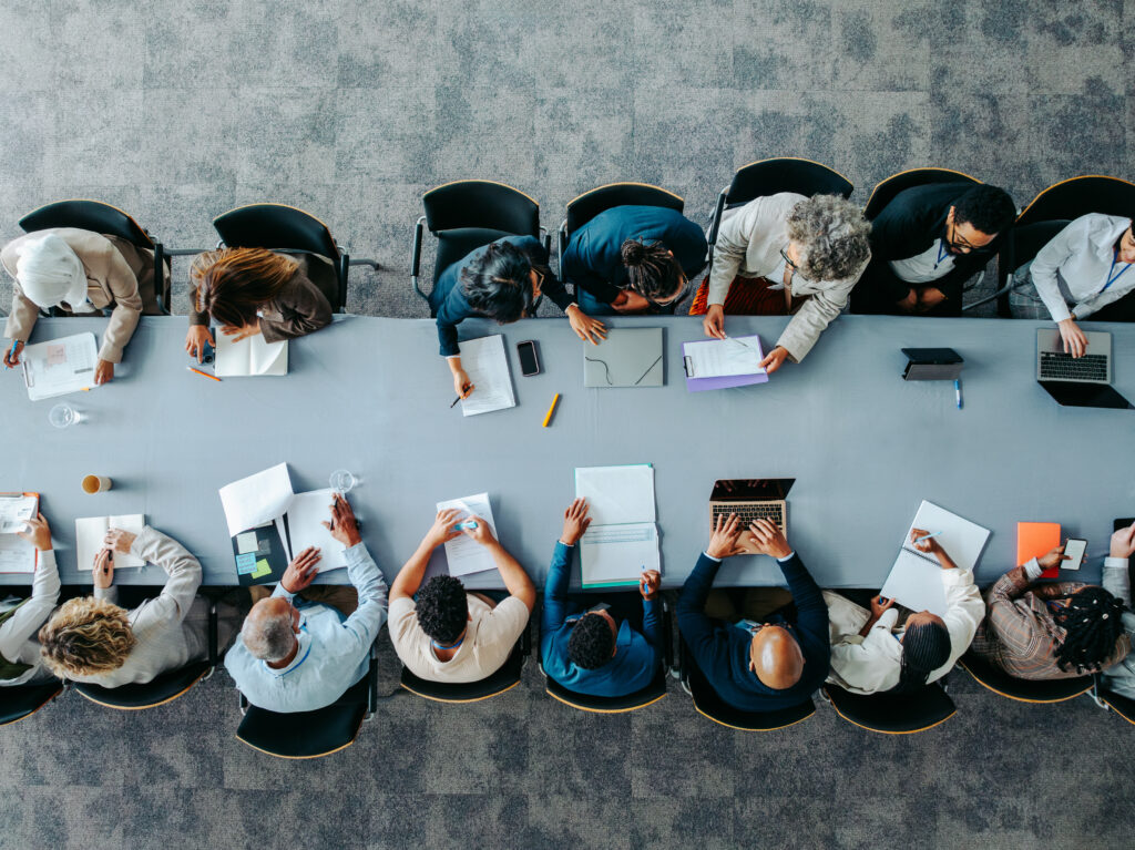 people gathered around a table at a staffing firm